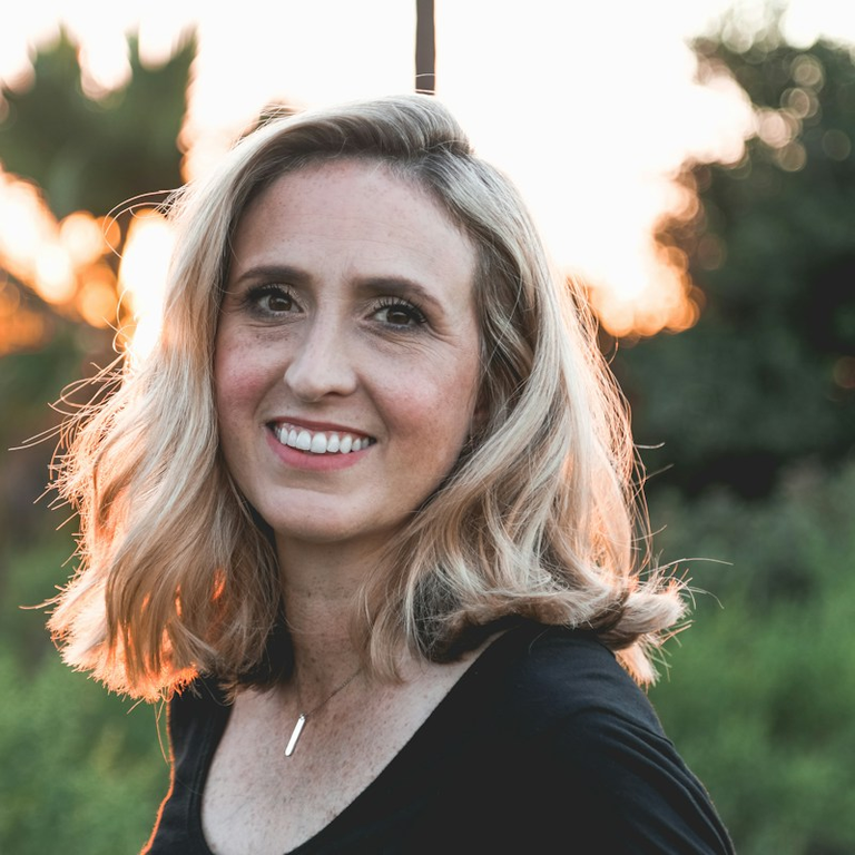 woman with blonde hair and black shirt